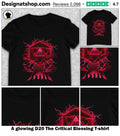 A glowing D20 The Critical Blessing shirt