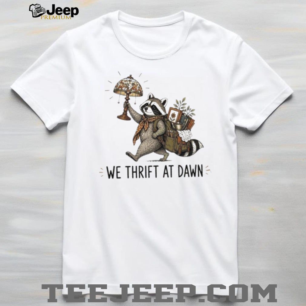Raccoon carrying lamp and backpack items We Thrift at Dawn t shirt