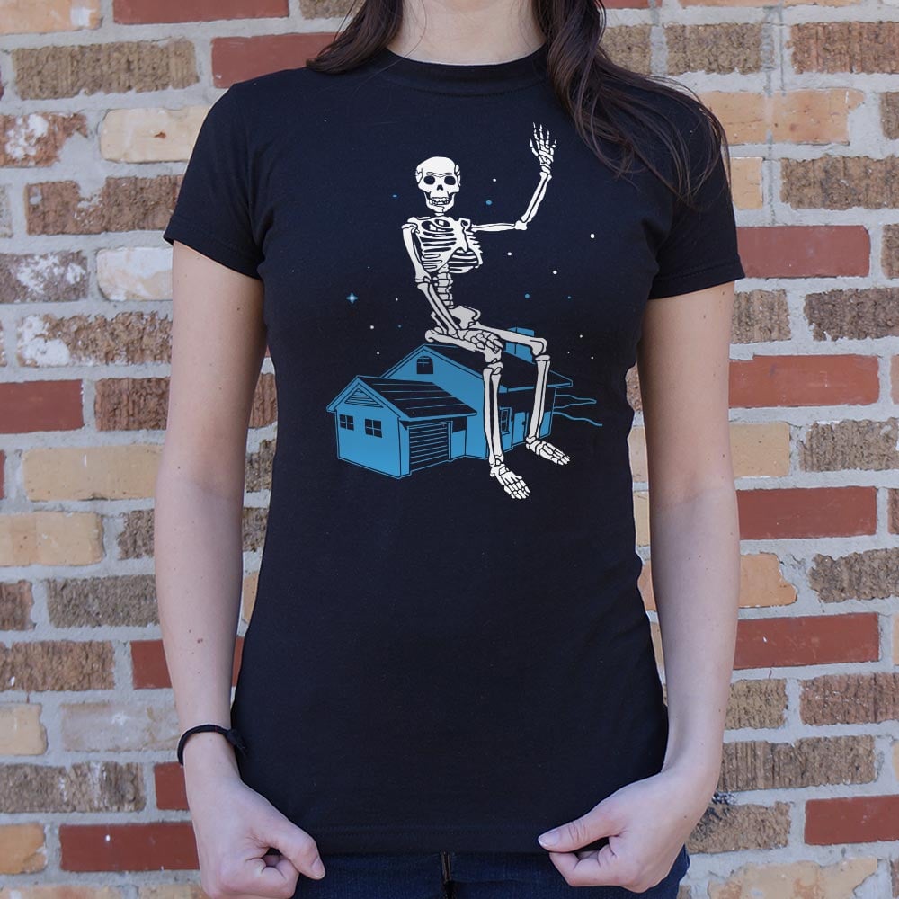 Giant Skeleton Waving from Rooftop of a House