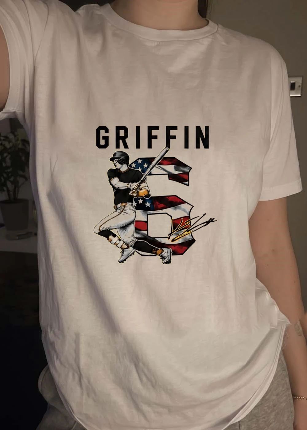 Signature Griffin Baseball Player Swinging Bat with American Flag Number 6 Shirt
