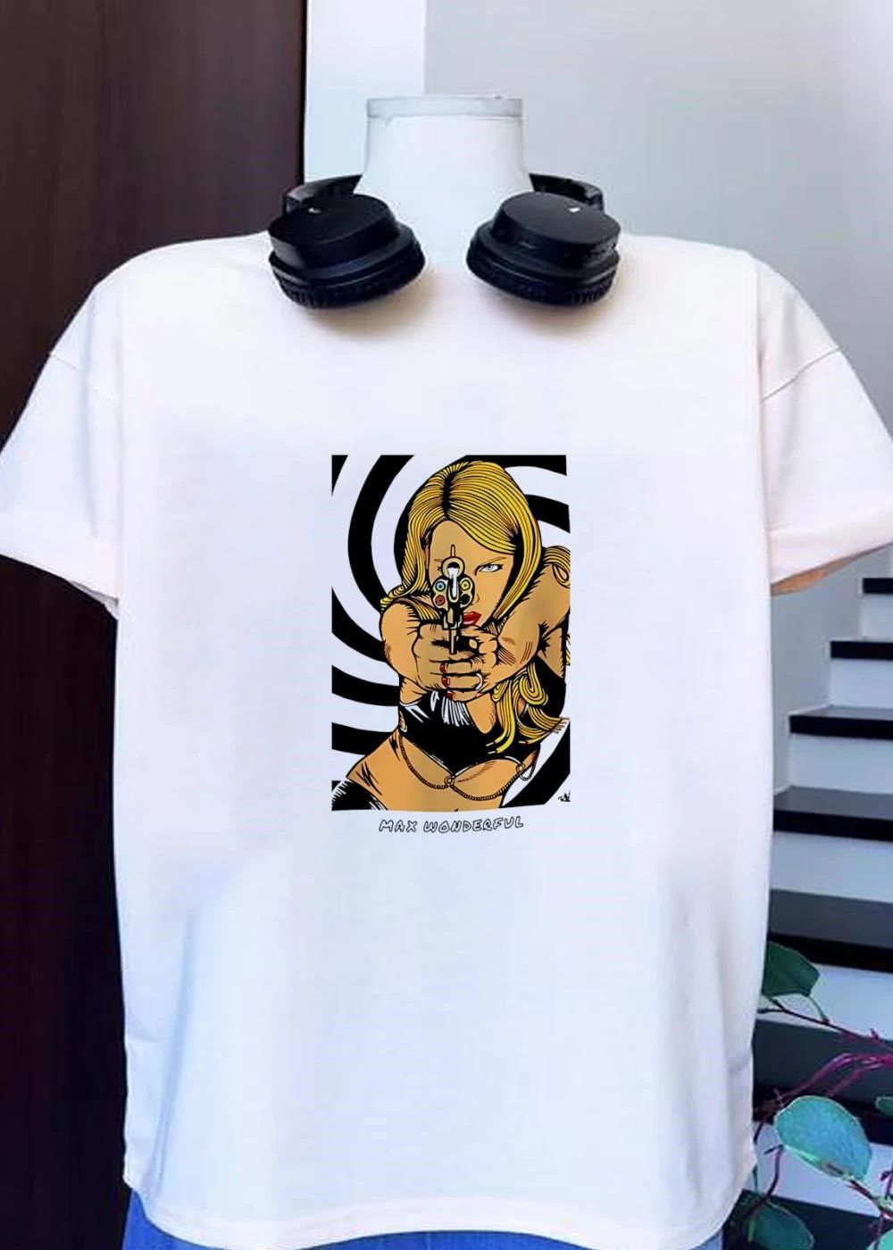 Max Wonderful blonde woman blue eyes aiming gun black bodysuit gold chain black white spiral shirt