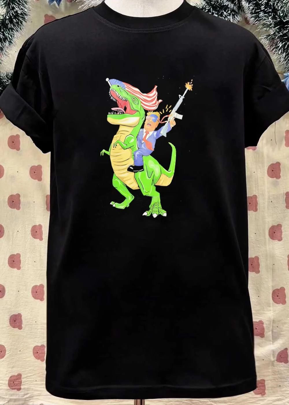 Patriotic Apparel Donald Trump Riding T-Rex Firing Rifle shirt